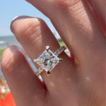 Load image into Gallery viewer, Princess Cut Moissanite Engagement Ring: 10K Rose Gold Solitaire with Diamond Prongs
