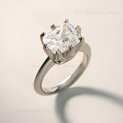 14k gold cushion moissanite east west solitaire engagement ring with heart-shaped claw prong basket setting